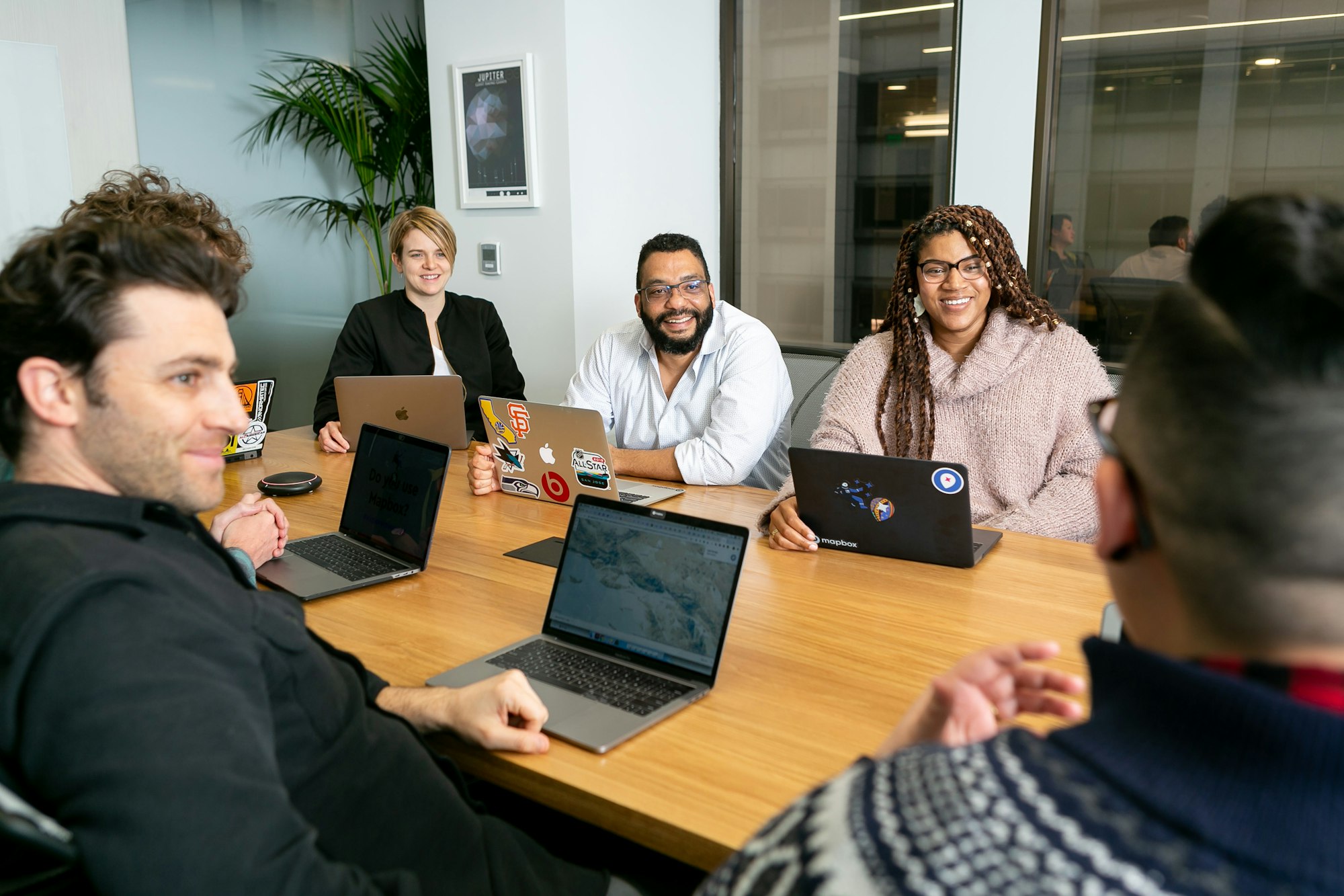 AFK People consultants meeting around a table