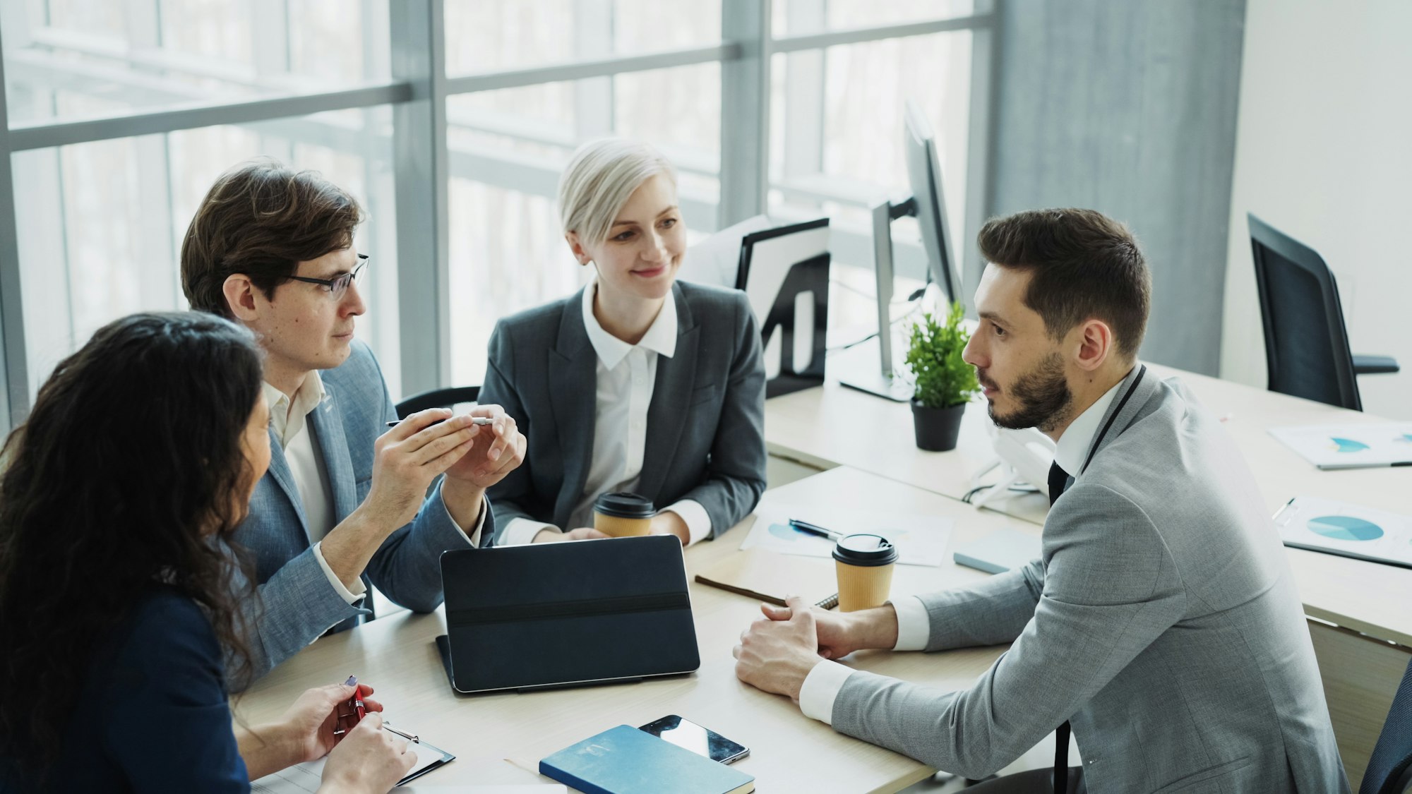 A professional team in discussion at a modern office
